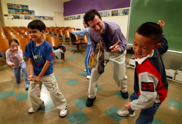 061396.ME.0313.bravo.1.ALS PACIFIC PALISADES, CA. Drama Teacher Jonas Basom and kids. Drama teacher Jonas Basom, one of the 3 recent winners of Bravo Award for arts education, uses drama as a method for teaching classroom lessons. He is a traveling teacher for LA Unified. He is working with 2nd grade students Aaron Girard (L) and Jonathan Vo (R) along with second grade students from Julie Yoshida's class at Marquez Elementary School in Pacific Palisades.